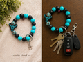 Western Turquoise Cow Print Wristlet